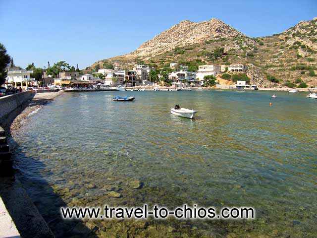 EMPORIOS - View of the small beach of Emporios and some fishing boats